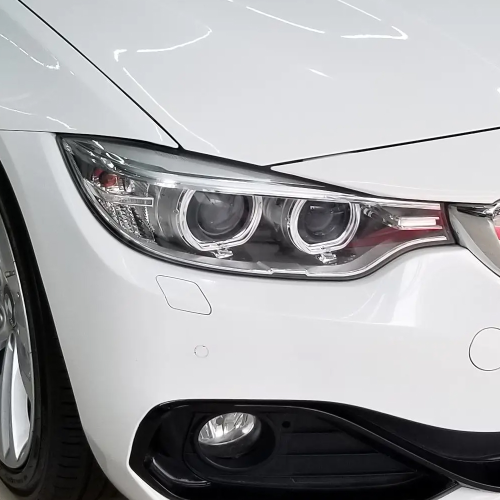 the enlarged diagram of the right side vision of BMW 4 series F32/F33/F36/F82 (13-16) headlight lens cover which has been installed on the 2015 year BMW 4series car the enlarged diagram of the right side vision of BMW 4 series F32/F33/F36/F82 (13-16) headlight lens cover which has been installed on the 2015 year BMW 4series car