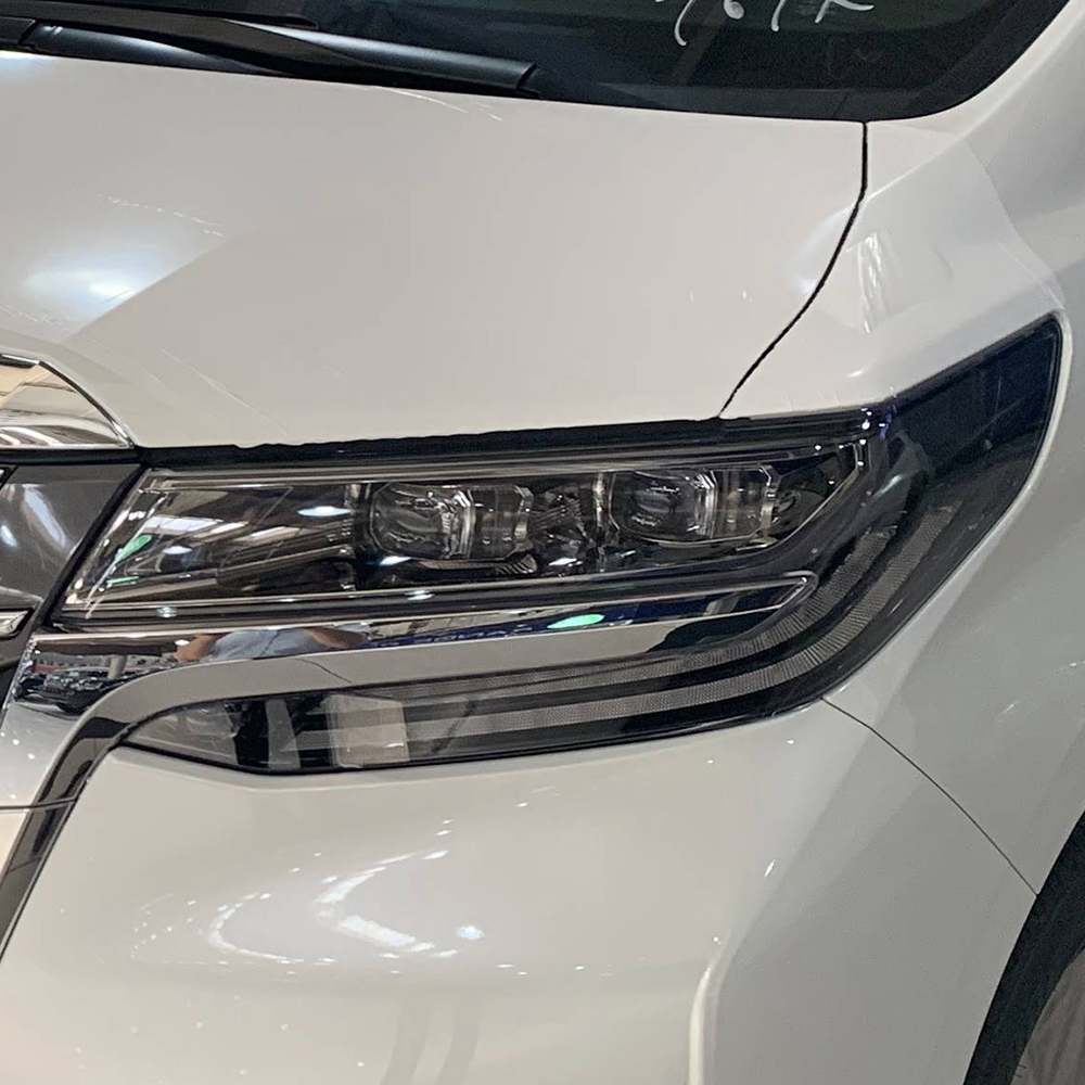 the enlarged diagram of headlight lens cover for toyota alphard